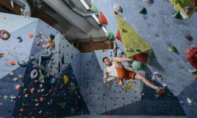 Climber solving bouldering problem during Olympic combined event
