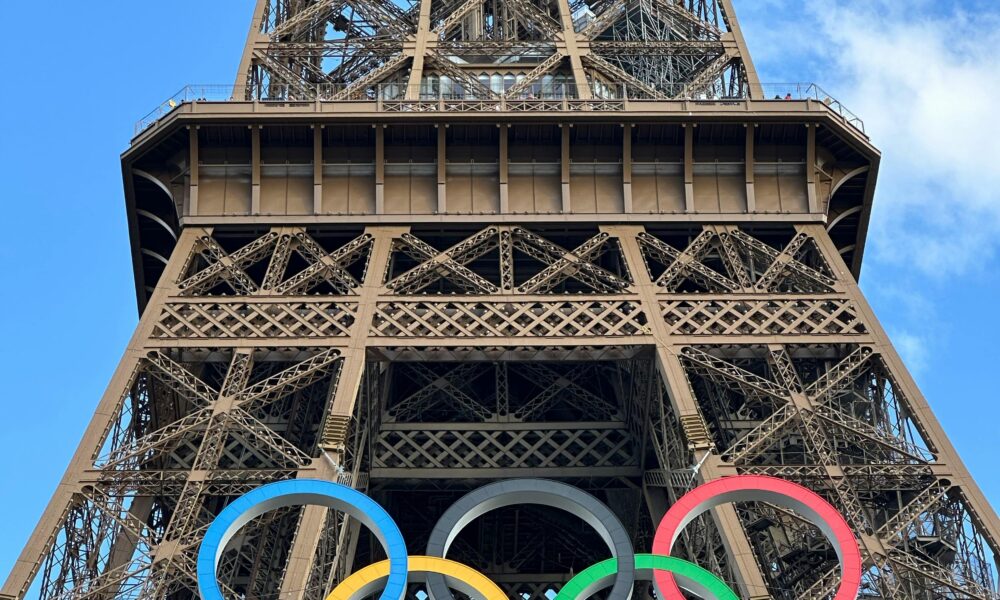 Concept design of Olympic rings in front of LA skyline.