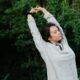Sunrise with a person stretching near a window, symbolizing a fresh start.
