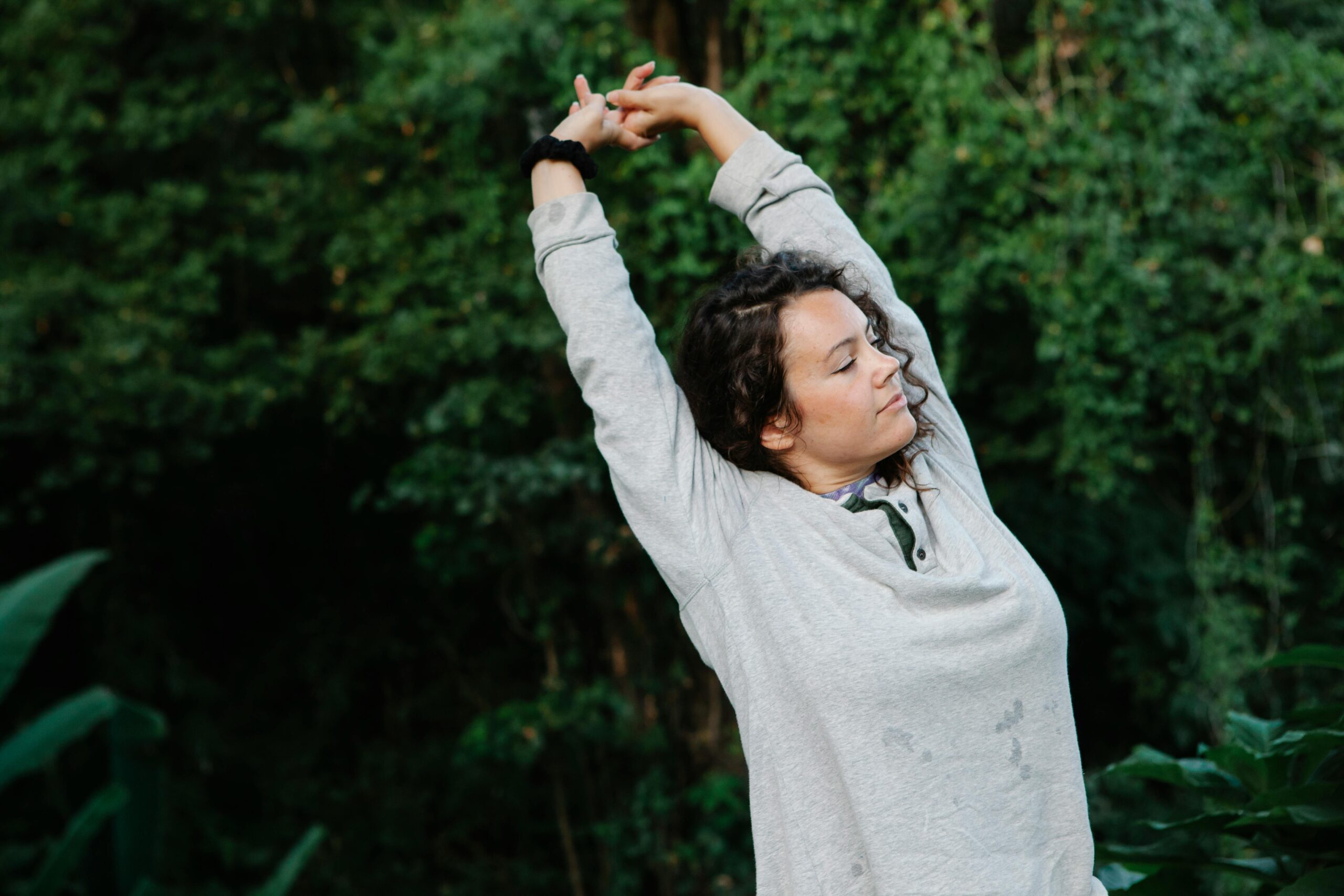 Sunrise with a person stretching near a window, symbolizing a fresh start.