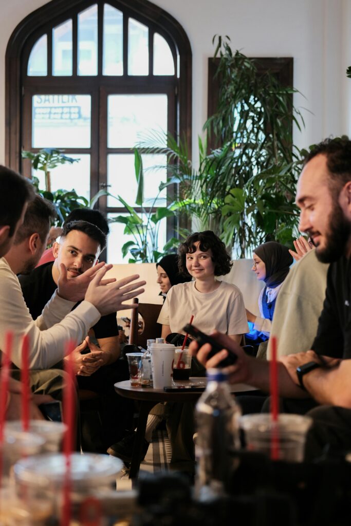 Group of friends at a cinema café cultural event