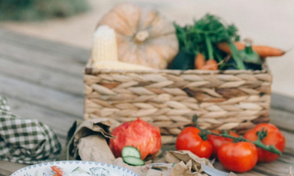 Person preparing fresh vegetables and fruits for healthy eating.