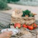 Person preparing fresh vegetables and fruits for healthy eating.