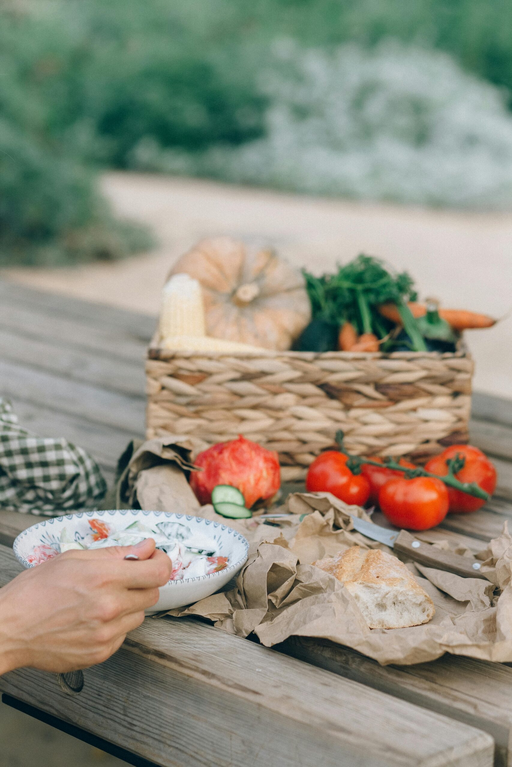 Person preparing fresh vegetables and fruits for healthy eating.