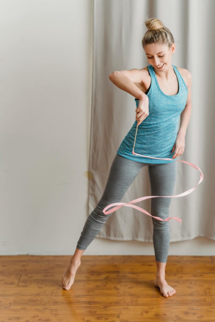 Woman dancing at home for daily exercise and weight loss.