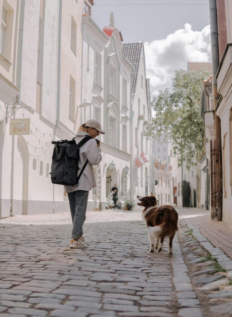 A solo woman walking through a scenic old town street.
