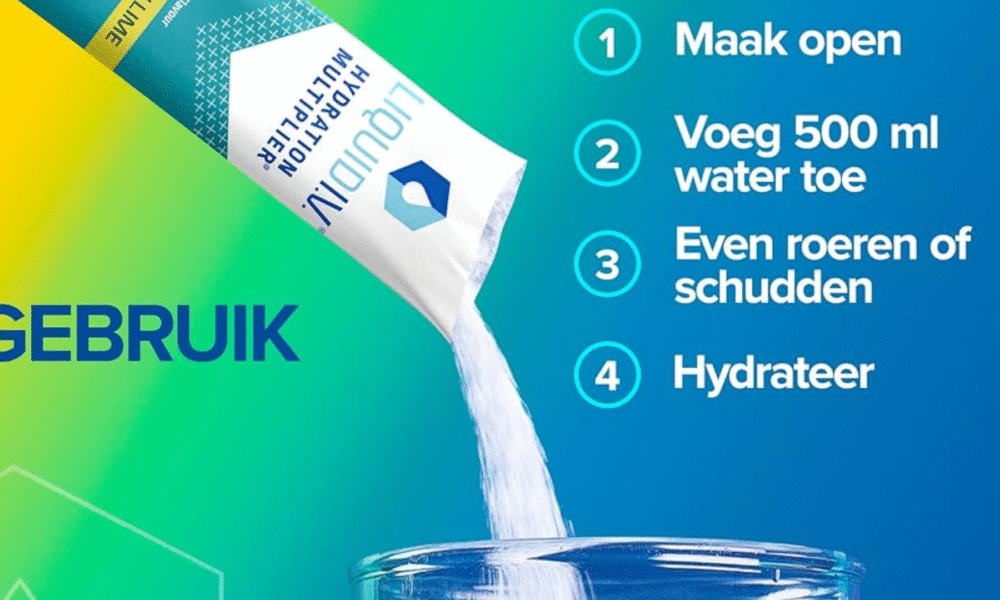 A tall glass of water with Liquid I.V. stick packet beside it.