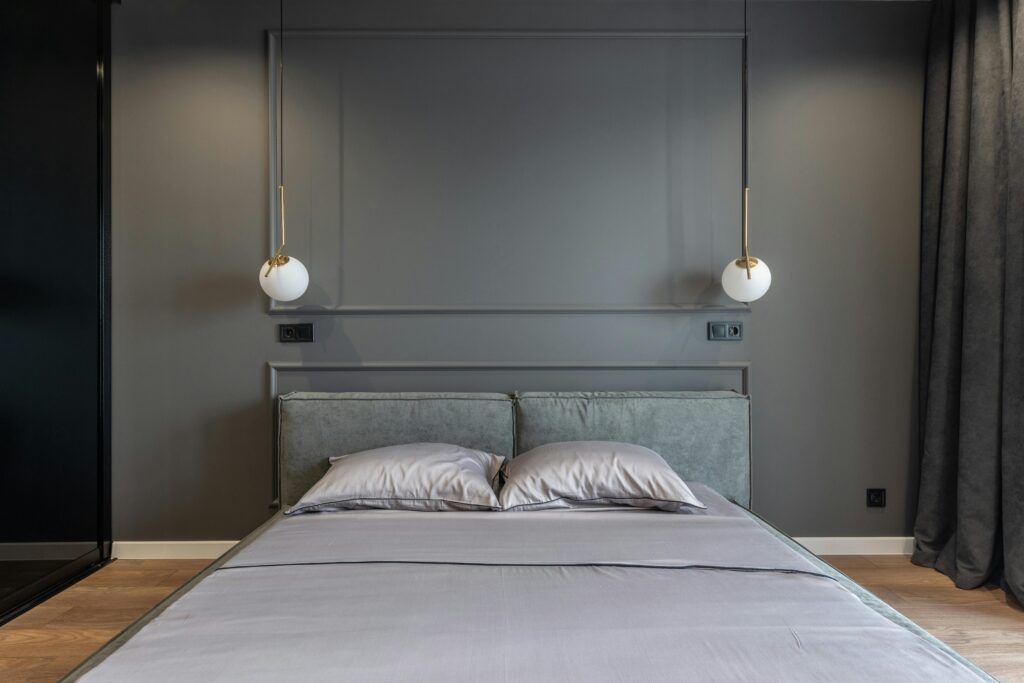 A cozy bedroom with dim lighting and clean bedding (to show ideal sleep environment).