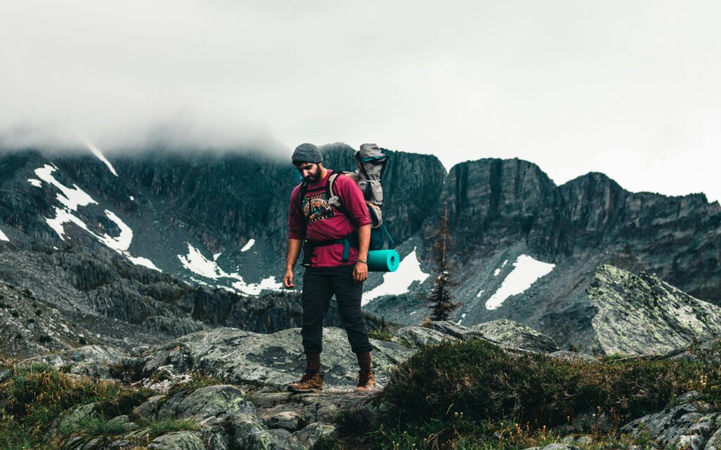 A hiker on a mountain trail (free outdoor activities).
