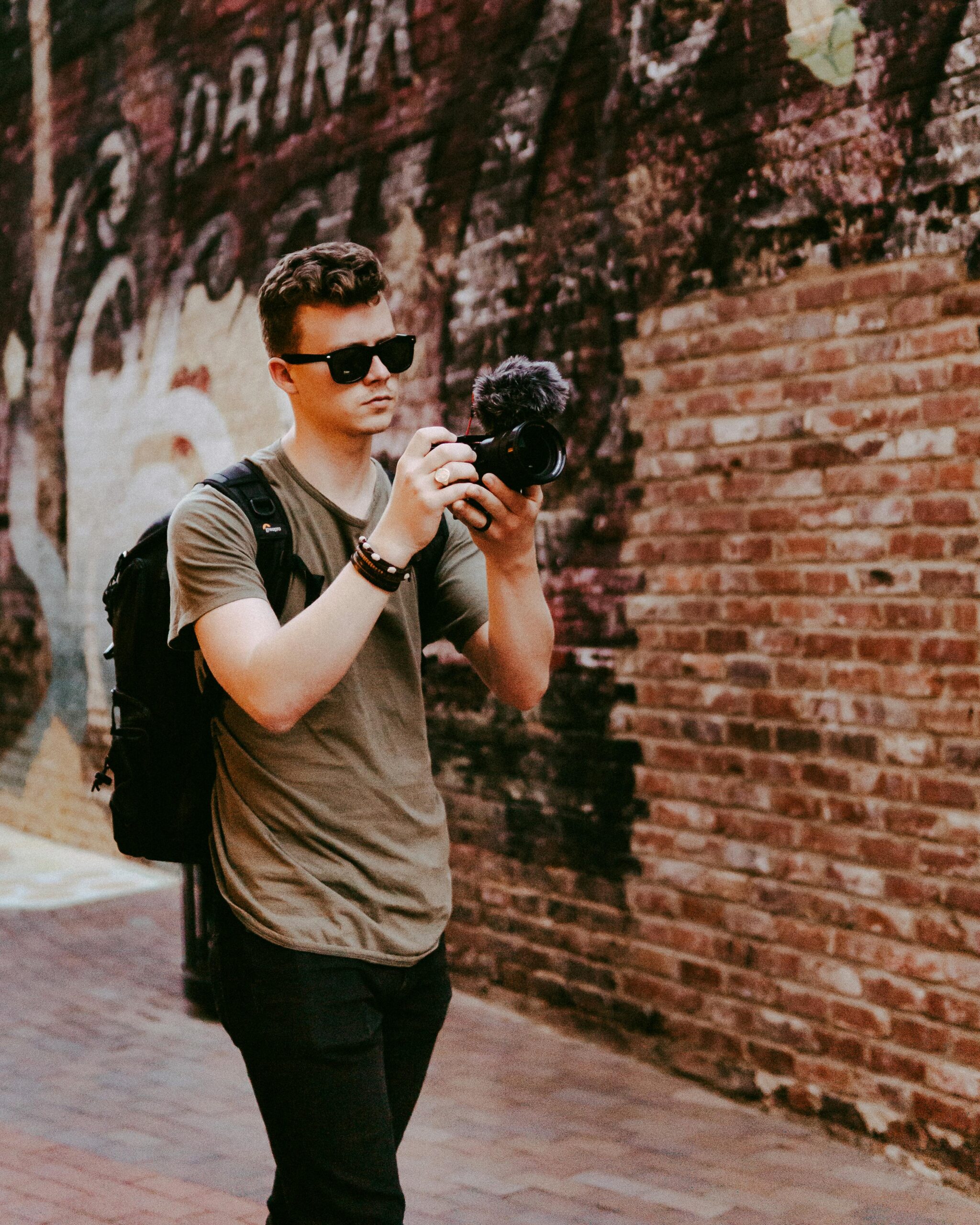 A traveler with a backpack exploring a city on foot.