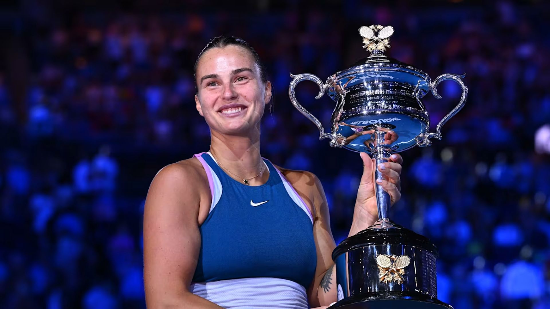 Aryna Sabalenka celebrating after match point – powerful victory shot.