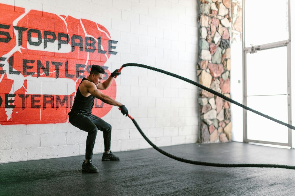 Athlete doing burpees or sprinting outdoors.