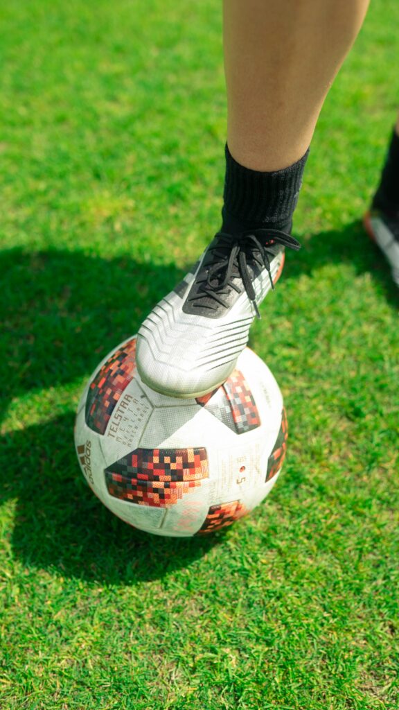 Professional soccer player wearing Adidas cleats
