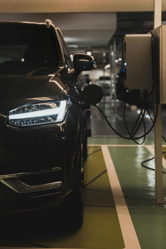 A sleek modern EV charging at a futuristic station.
