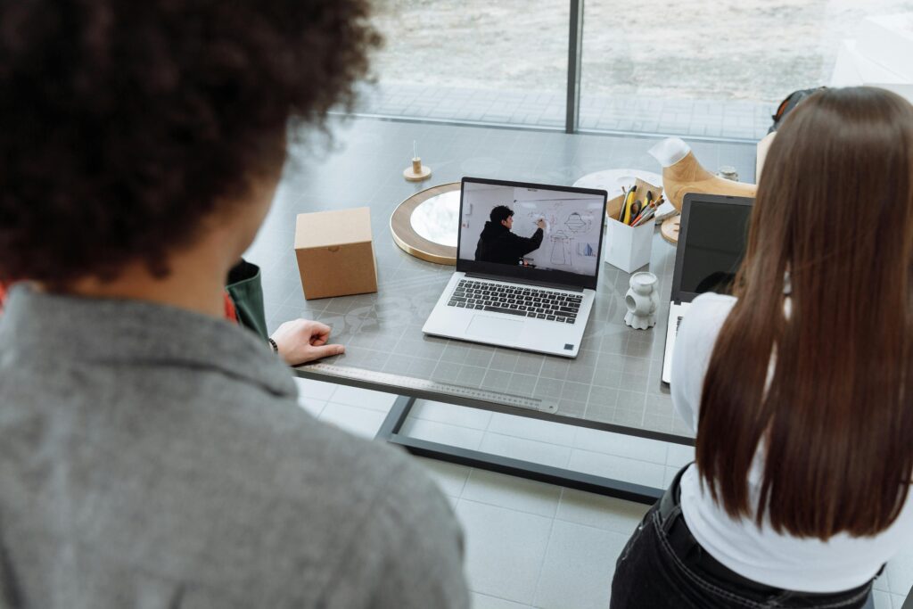 Screenshot-style image of Zoom or Teams hybrid meetings.