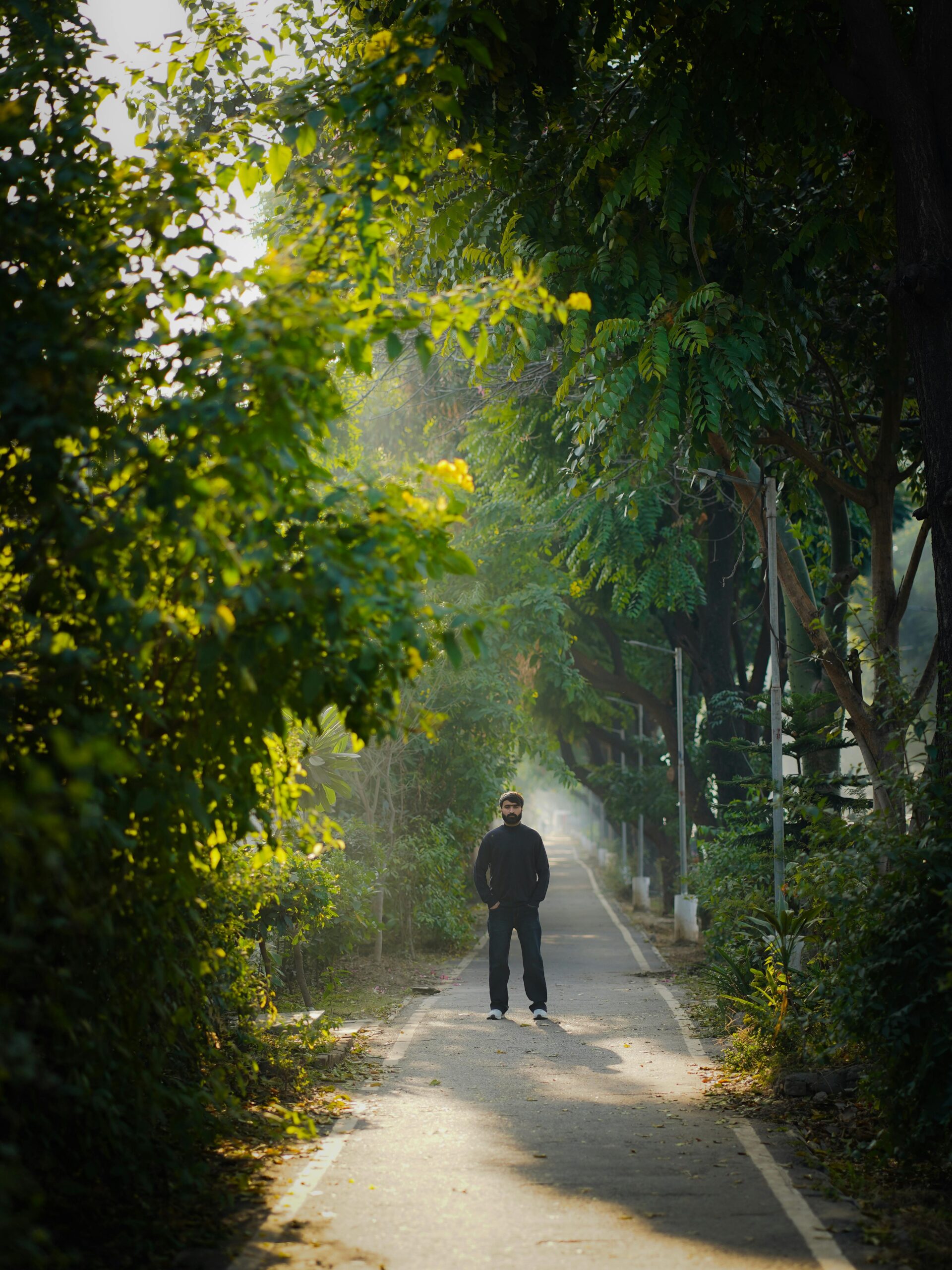 Natural sunlight exposure – person walking outdoors in the morning.