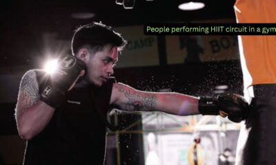People performing HIIT circuit in a gym.