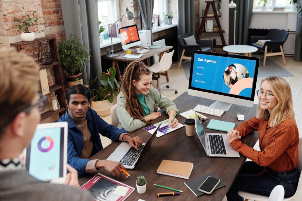 People in a Zoom/Teams grid view smiling and engaged.