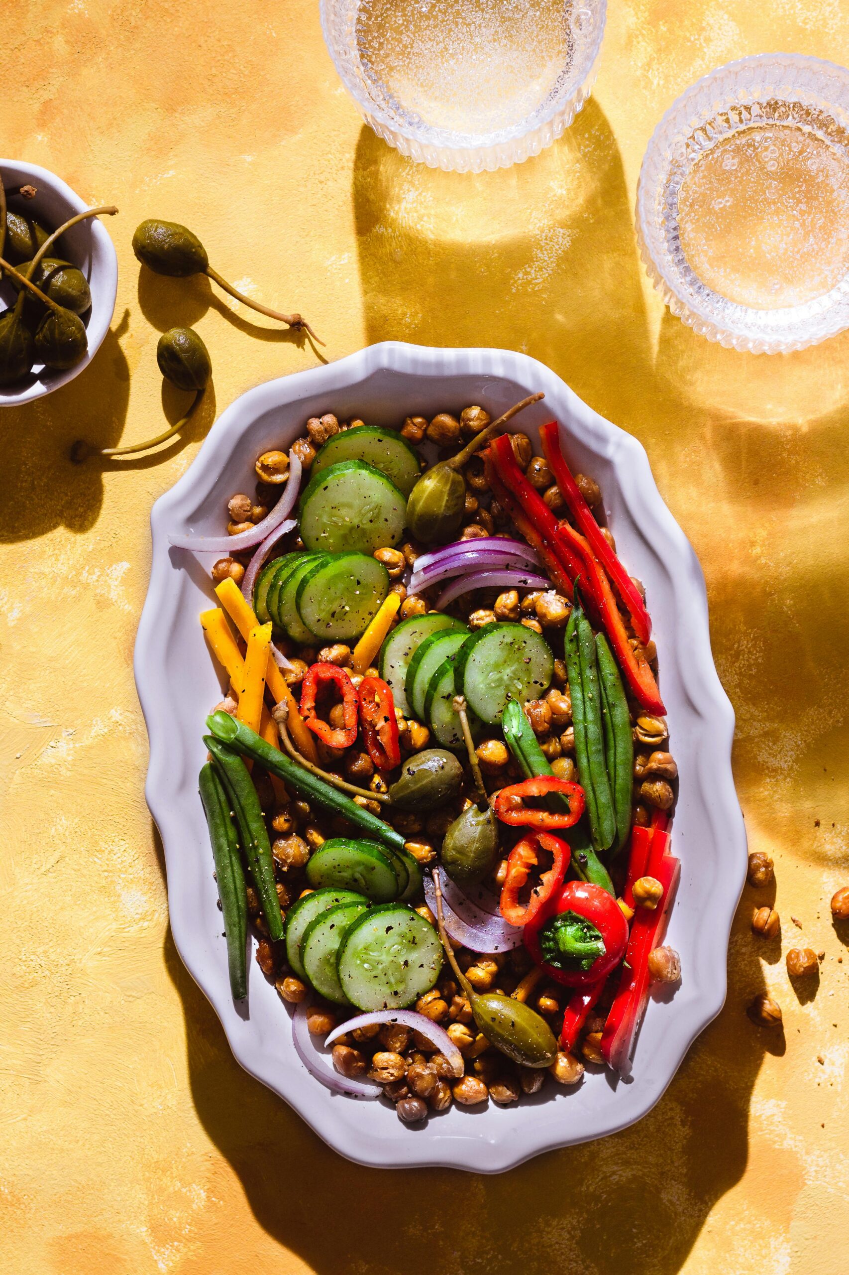 A vibrant bowl of salad with kale, spinach, and colorful veggies.