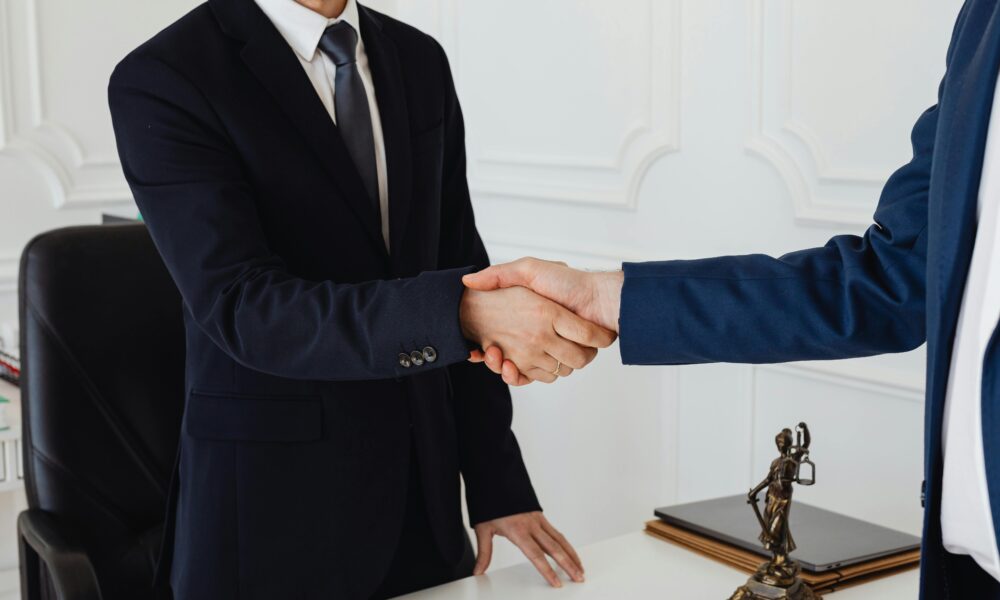 Silk tie being tied in a Windsor knot for business meeting