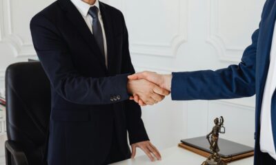 Silk tie being tied in a Windsor knot for business meeting