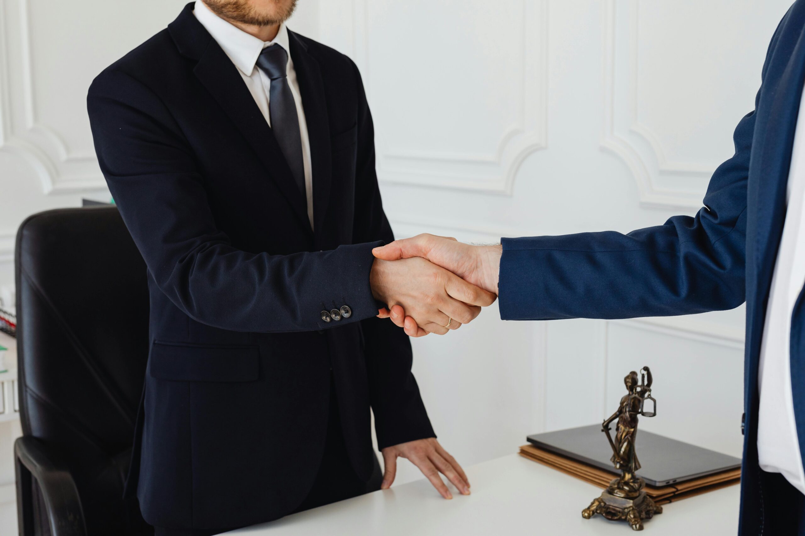 Silk tie being tied in a Windsor knot for business meeting