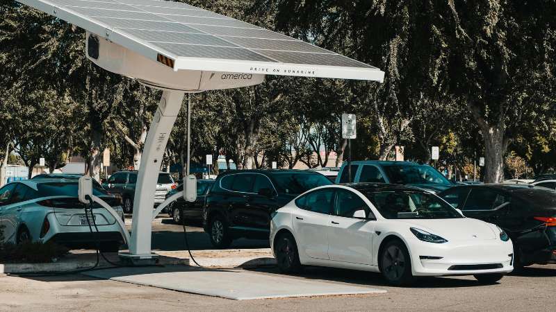Electric vehicle charging at a fast station highlighting EV technology and sustainable mobility innovation