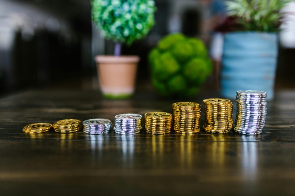 Coins stacked in ascending order showing savings growth.