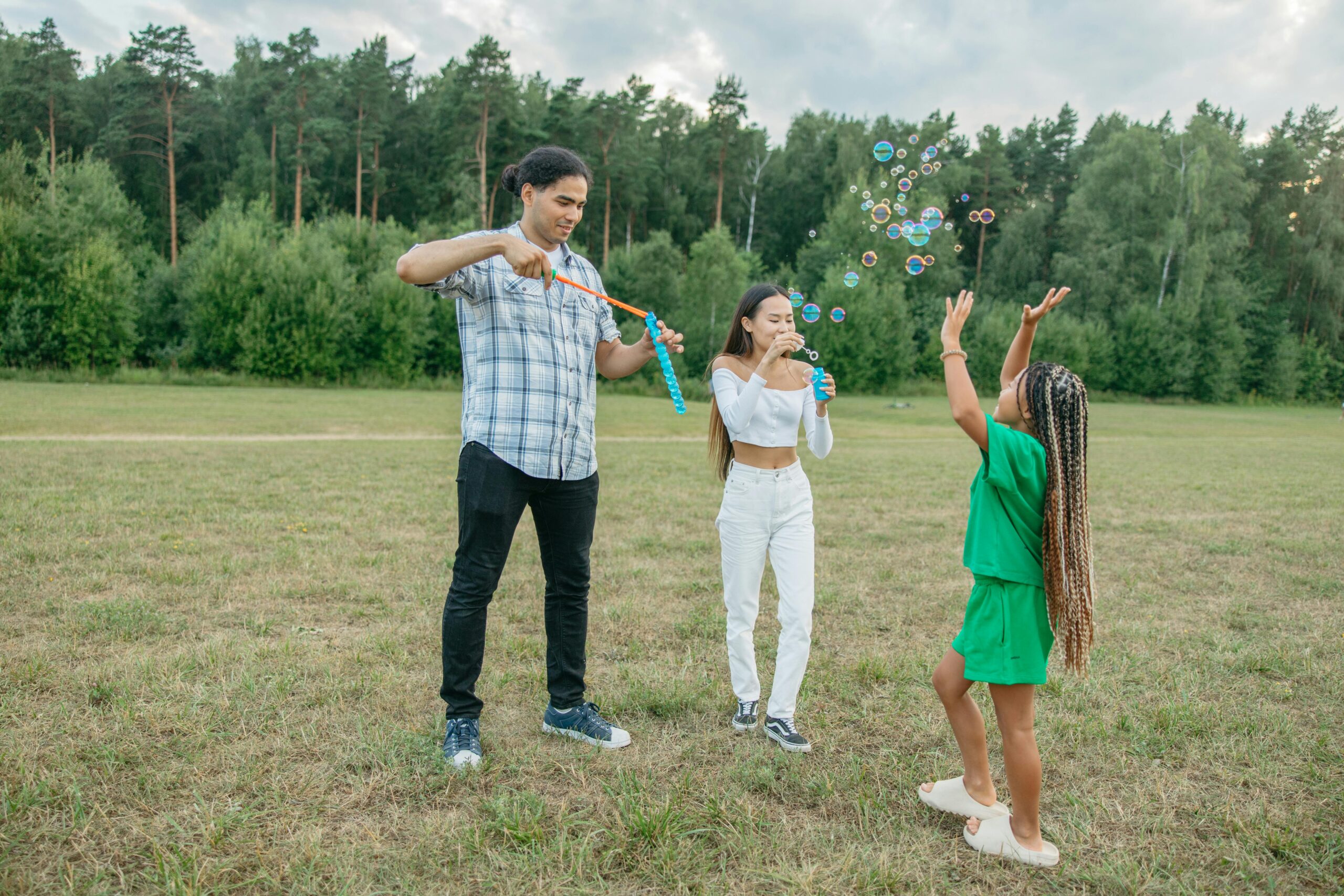 Bright outdoor atmosphere, green grass, sun, smiles