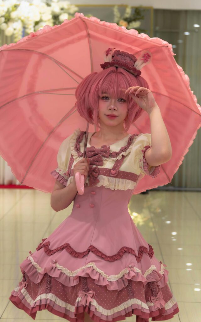 A Sweet Lolita outfit with pastel colors and lace details