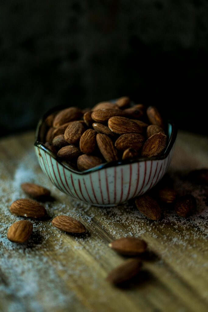 A close-up shot of soaked almonds in a bowl.