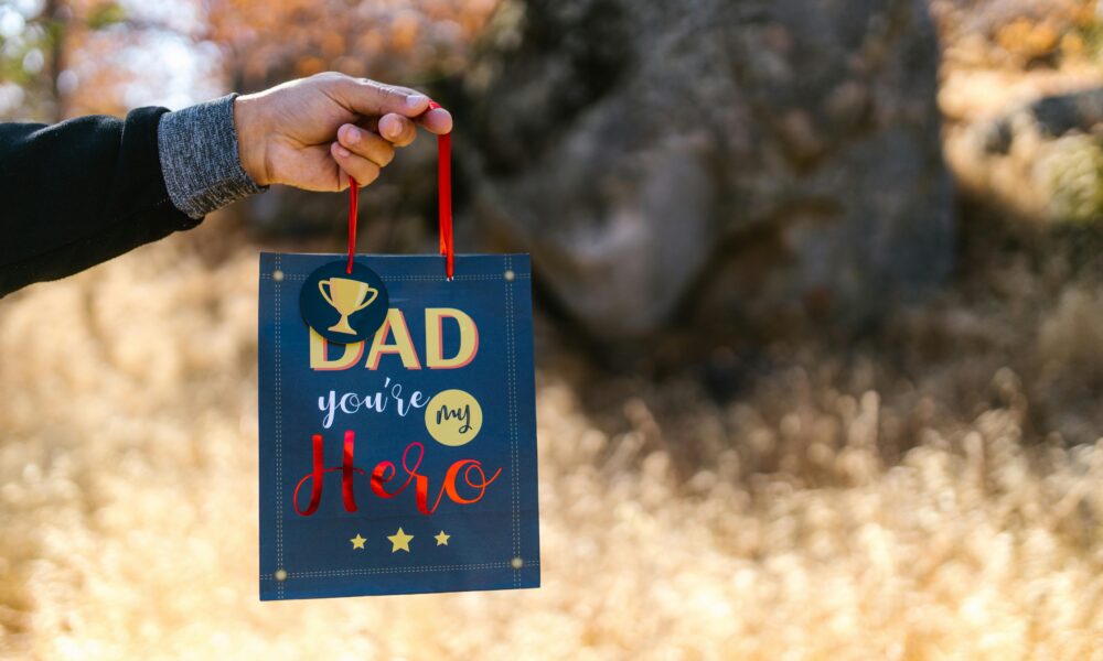 Person holding gift cards and cash