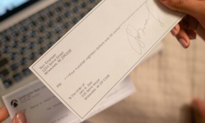 How to write a check step by step with example showing date, payee, amount in numbers and words, memo, and signature