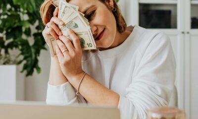 Person using a laptop and earning money online.