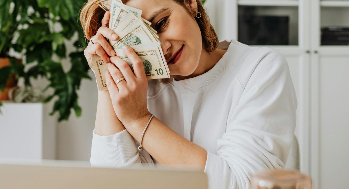 Person using a laptop and earning money online.