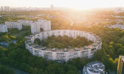 Aerial view of a modern smart city with green rooftops.