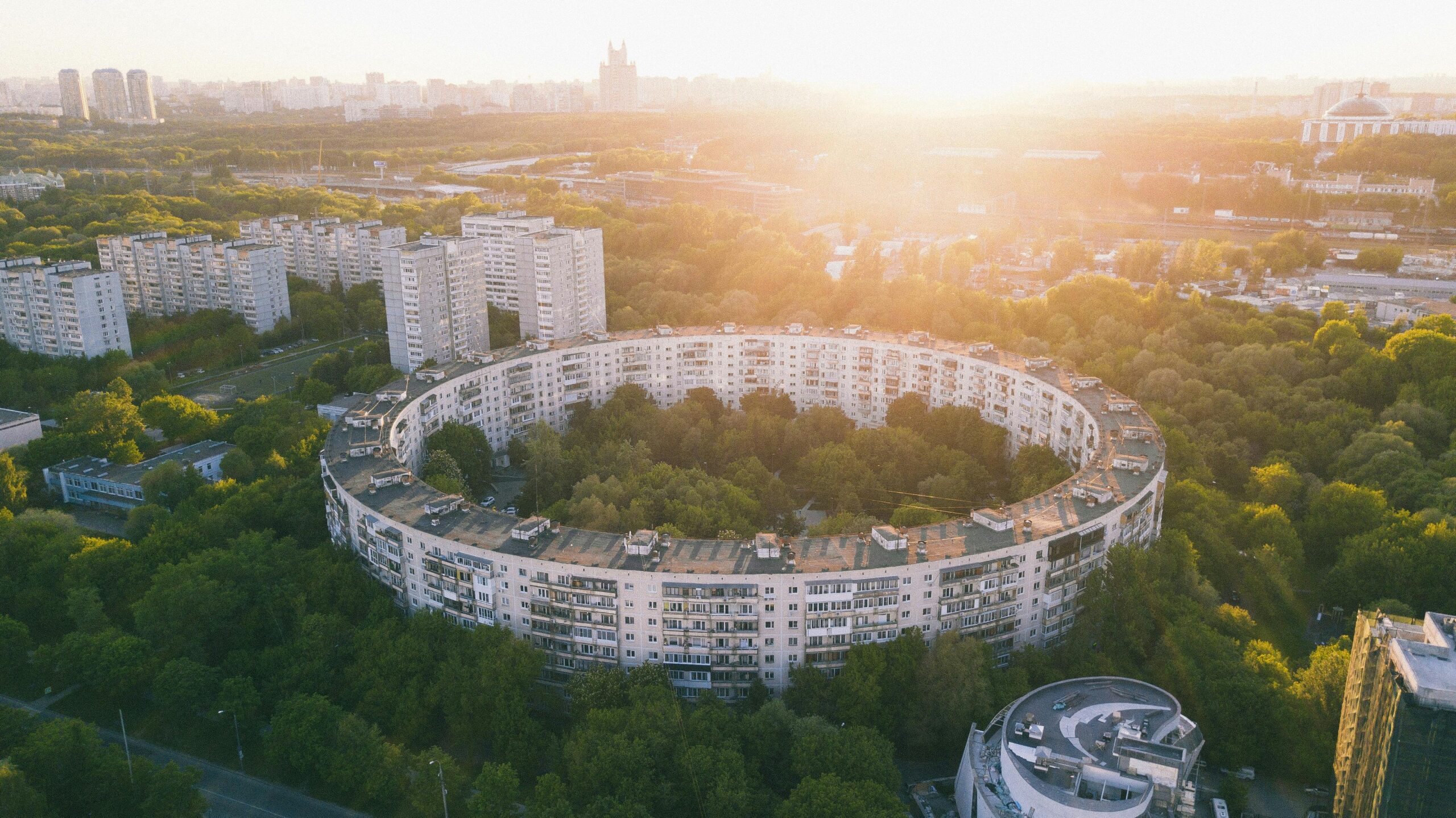 Aerial view of a modern smart city with green rooftops.