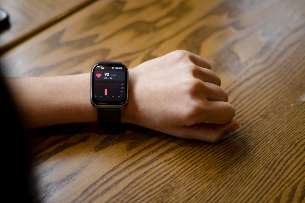Smartwatch on wrist – showing heartbeat or fitness stats