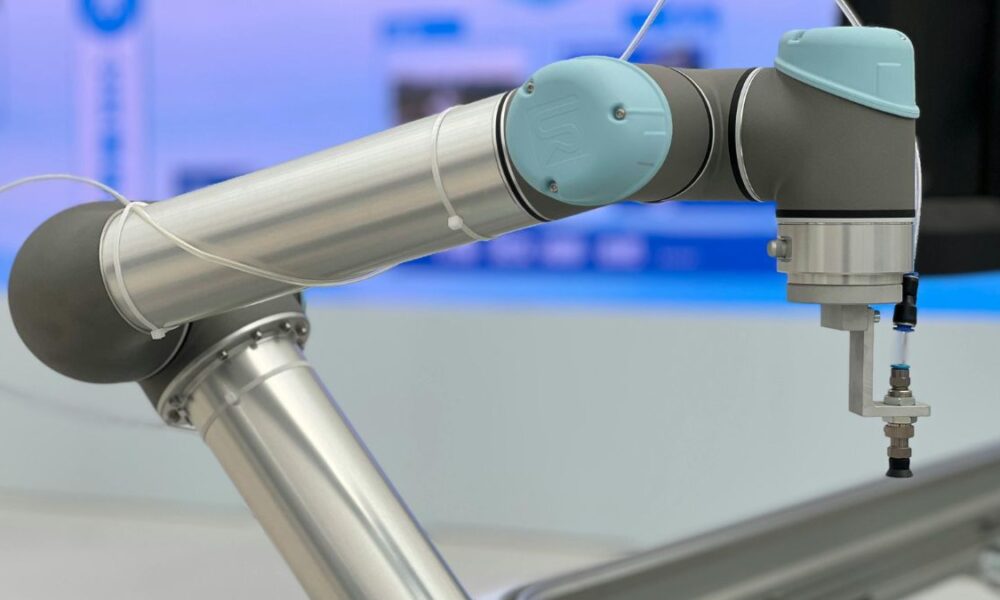 Modern industrial robotic arm performing automated manufacturing tasks with AI integration