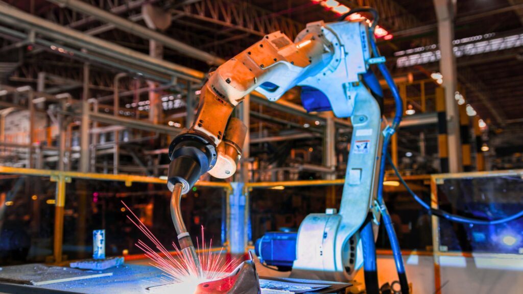 Robotic arms working on an automotive assembly line