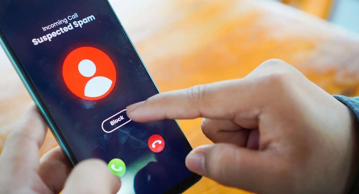 iPhone screen showing spam call blocked notification to stop unwanted calls